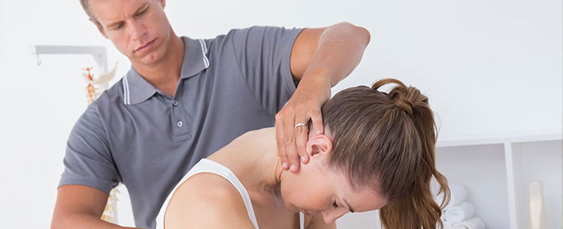 Chiroprator at Advanced Health Chiropractic in Livermore adjusting female patient's neck to relieve whiplash effects