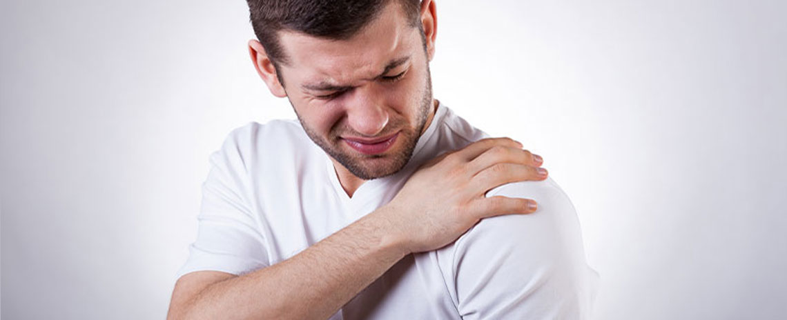 Man suffering with frozen shoulder in need of a chiropractic adjustment at Advanced Health Chiropractic in Livermore