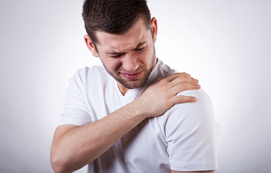 Man suffering with frozen shoulder in need of a chiropractic adjustment at Advanced Health Chiropractic in Livermore