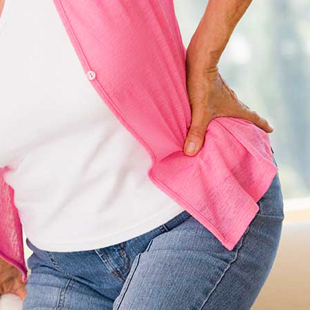 Woman suffering with hip pain in need of chiropractic care in Livermore